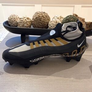 Nike Black and Gold Athletic Cleats